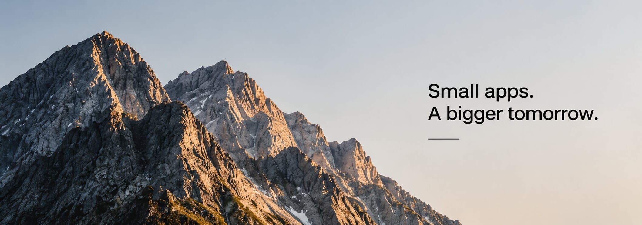 Mountain range at sunset with the words 'Small apps. A bigger tomorrow.'